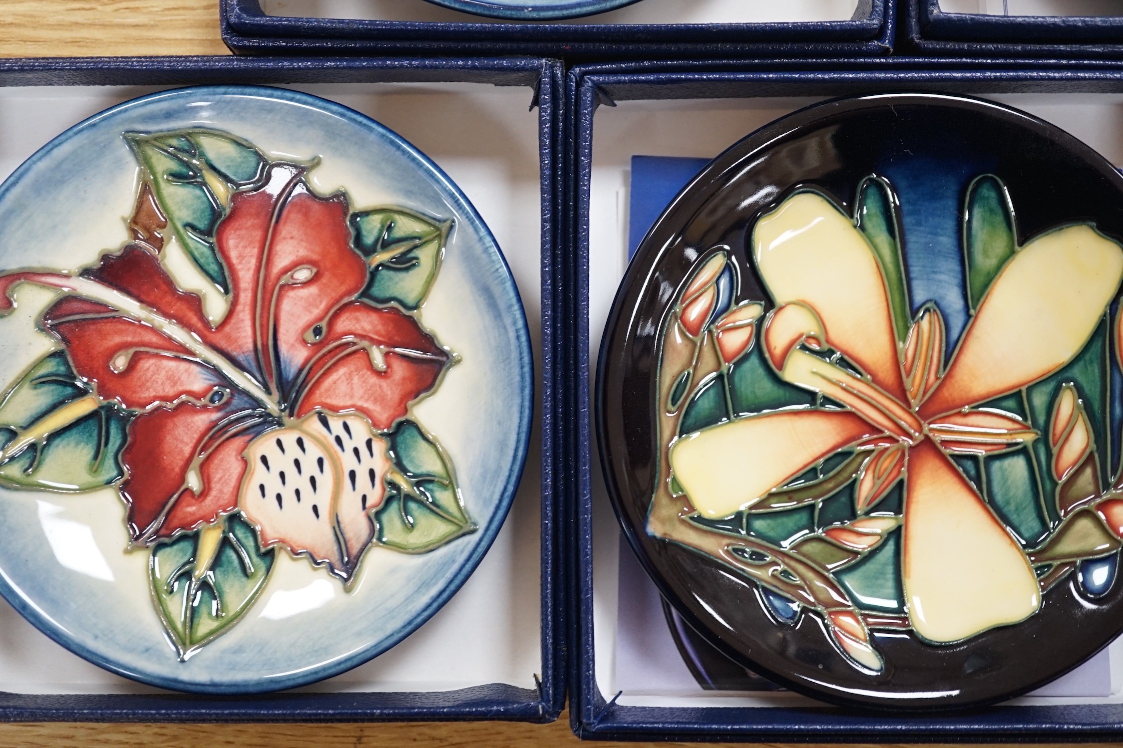 Six boxed Moorcroft pin dishes, A Woodside Farm, Panache, Simeon, Triple Choice, and Anna Lily. Each 11.5cm diameter